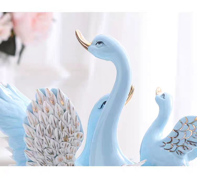 Grace in Motion – Ceramic Swan Family Sculpture